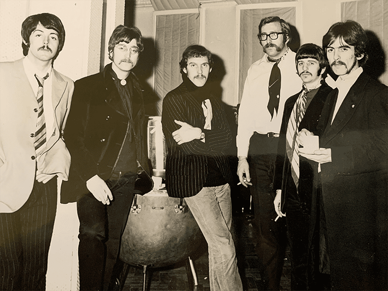 Mal Evans with The Beatles and Neil Aspinall. From left to right:
Paul McCartney, John Lennon, Neil Aspinall, Mal Evans, Ringo Starr and George Harrison.