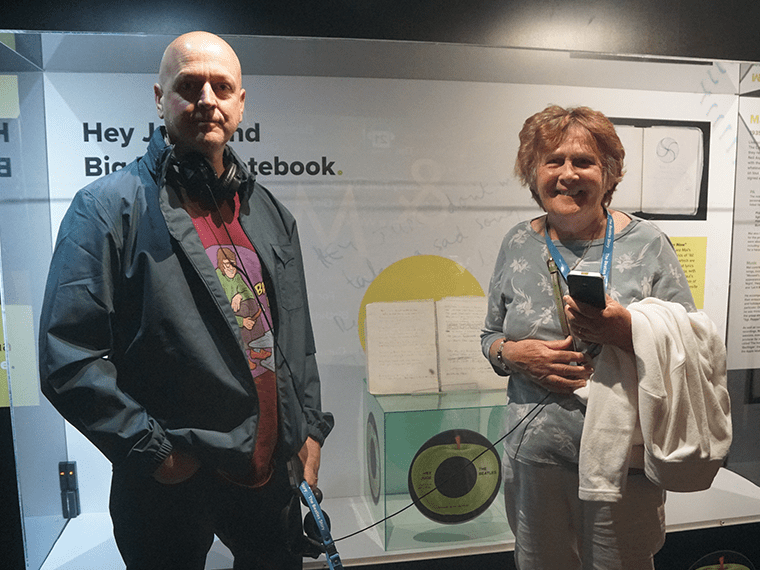 Barbara and Mal visiting the notebook at The Beatles Story, Liverpool.