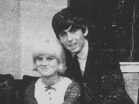 an aged black and white photo of bernie and george harrison