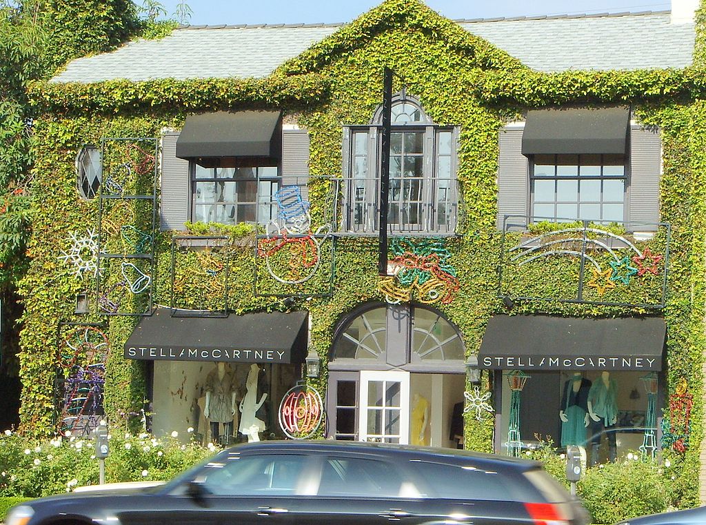stella mccartney's beverly hills store, covered in greenery and plants.