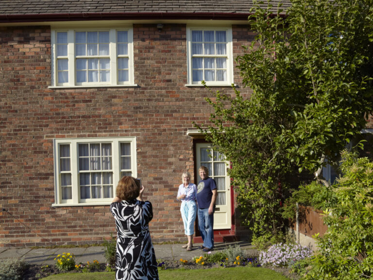 The Custodian takes photographs for visitors at 20 Forthlin Road, Allerton, Liverpool.