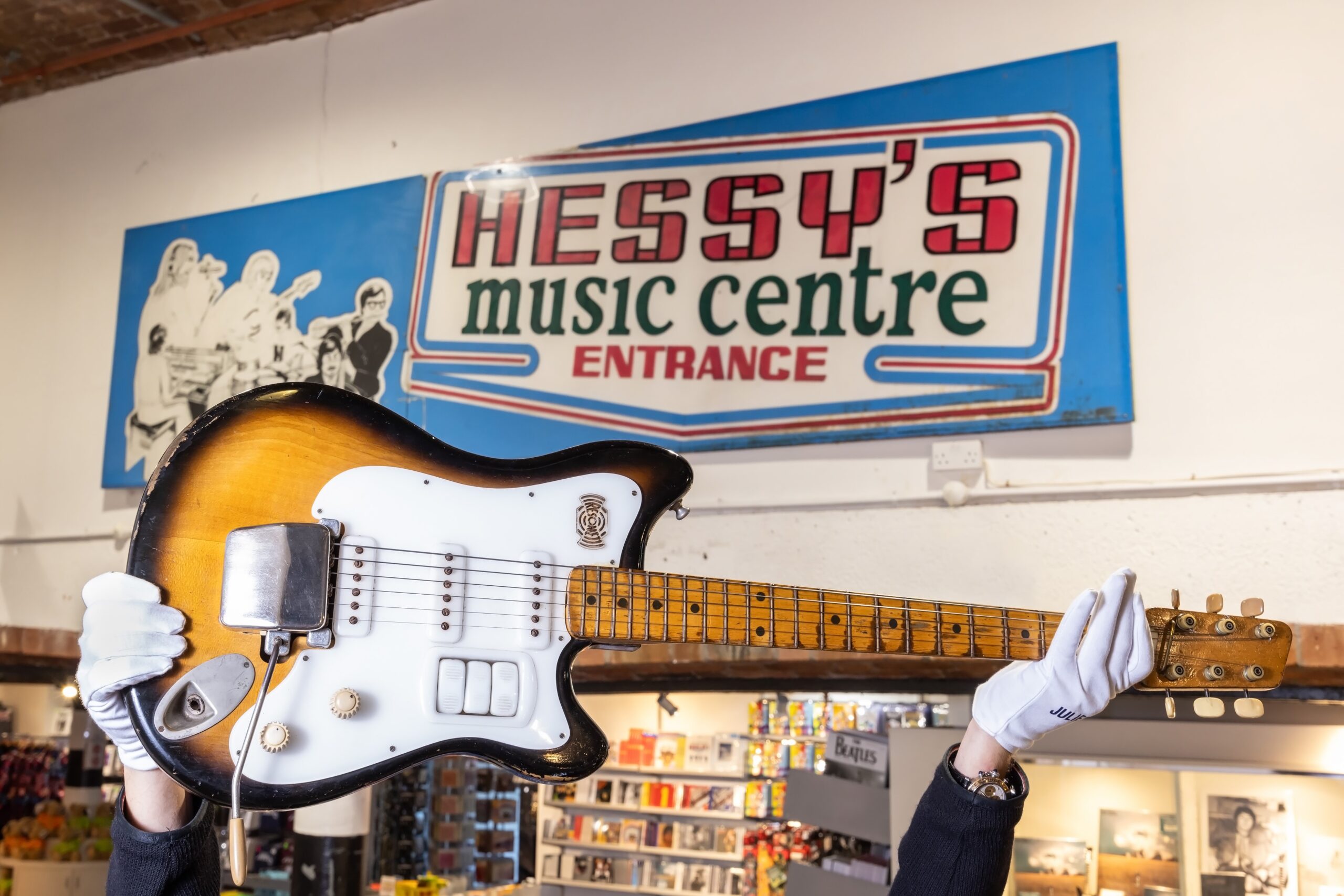 George Harrison's Futurama Guitar at The Beatles Story with original Hessys shop sign