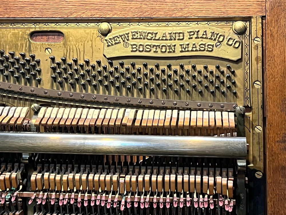 The New England Piano Company upright piano